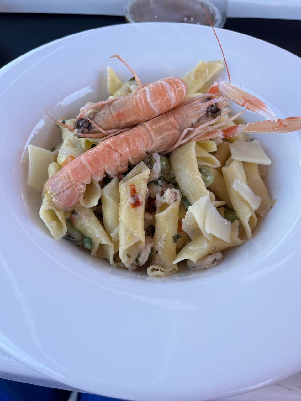 Fresh seafood pasta with langoustines served on the boat